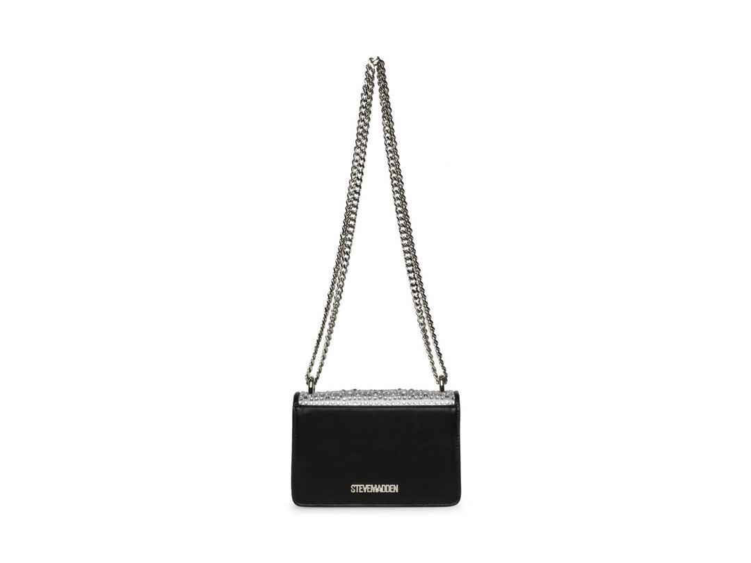 Bolso negro de Steve Madden con cadena plateada, detalles de pedrería brillante y un adorno metálico en forma de ave.