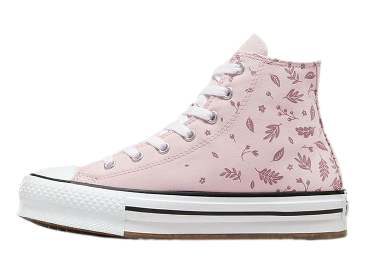 Tenis Converse rosa con estampado de hojas y suela de plataforma blanca.