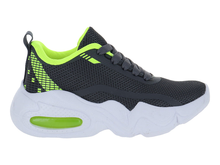 Tenis deportivos infantiles color gris con detalles en amarillo neón y suela blanca gruesa.