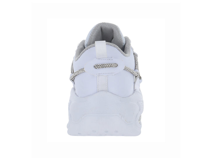 Tenis blancos para Niño o Niña con detalles brillantes en plata y suela gruesa.