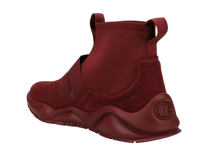 Tenis Champion modelo Flood Rally Pro en color burgundy con diseño tipo calcetín y banda elástica frontal.