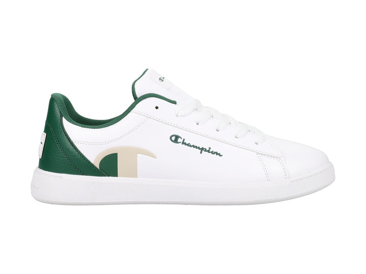 Tenis Champion color blanco con detalles en verde oscuro y beige, diseño deportivo de perfil bajo.