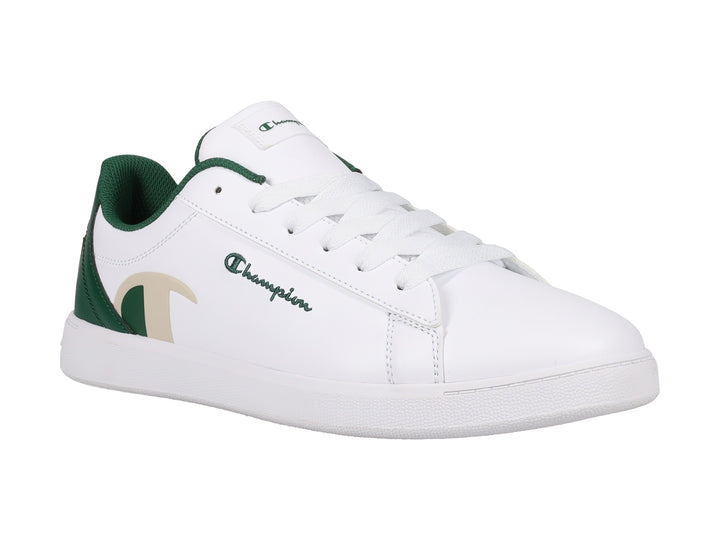Tenis Champion color blanco con detalles en verde oscuro y beige, diseño deportivo de perfil bajo.