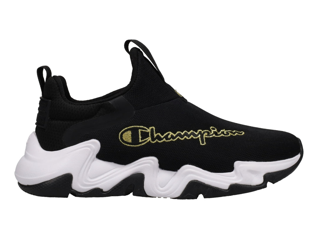 Tenis deportivos Champion color negro con suela blanca gruesa y logotipo dorado lateral.