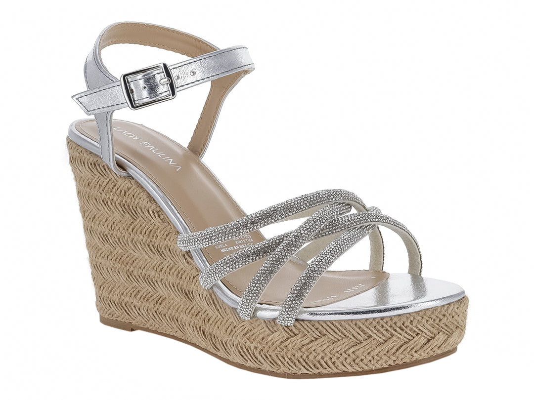 Sandalia de plataforma cuña color plata con tiras brillantes y tobillera con hebilla para mujer.