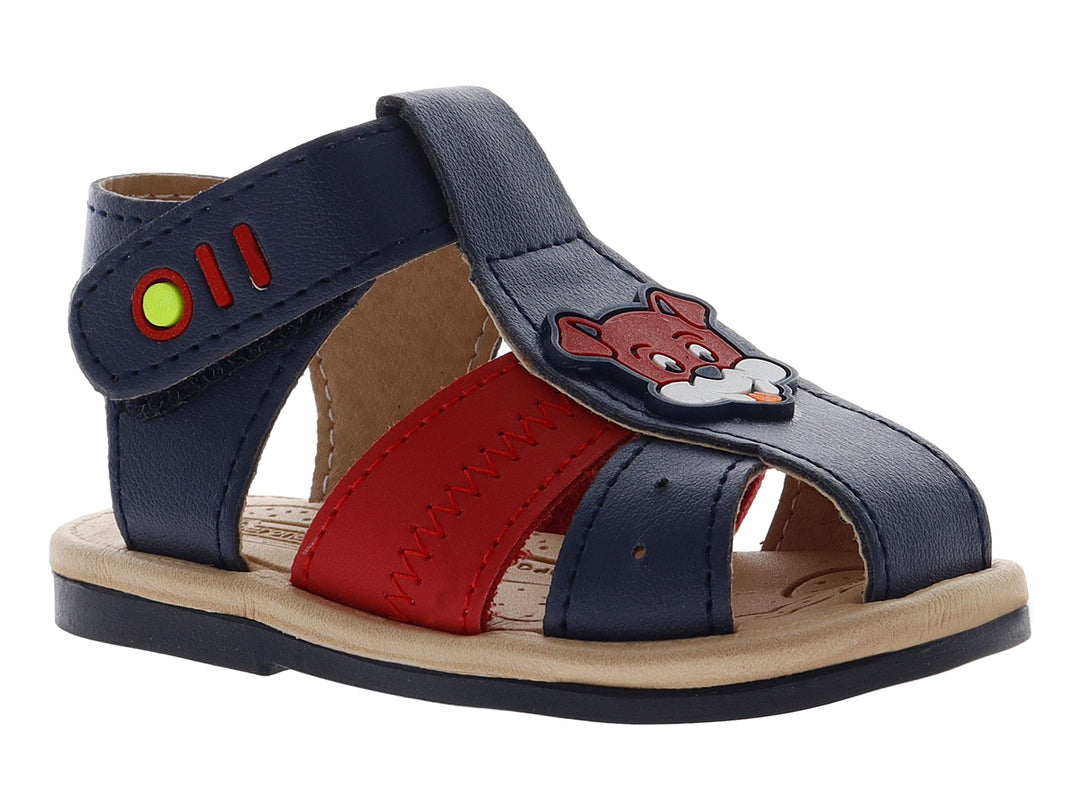 Sandalia infantil de color azul con una banda roja y suela beige, diseño casual con cierre de velcro.