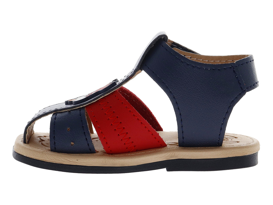 Sandalia infantil de color azul con una banda roja y suela beige, diseño casual con cierre de velcro.