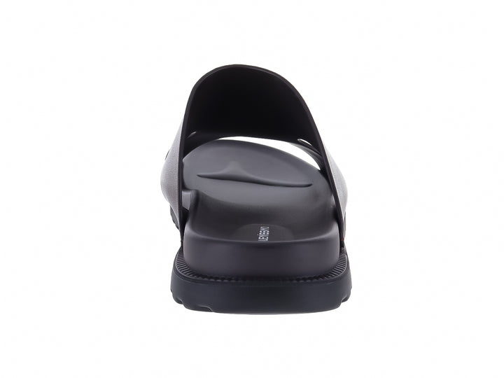 Sandalia Buenissimo de cuero color marrón con suela negra dentada para hombre.
