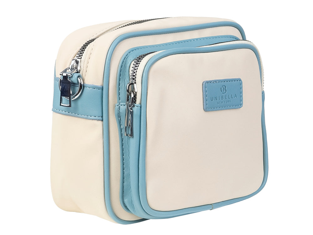 Bolso pequeño color beige con detalles en azul claro y logotipo de UNIBELLA en el centro.