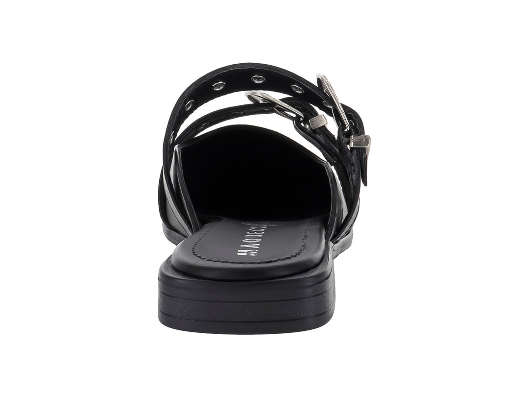 Zapato mule color negro para mujer con dos hebillas decorativas en color plata y punta cerrada.