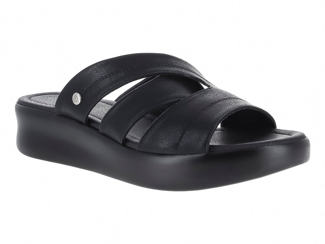 Sandalia negra de plataforma para mujer con correas cruzadas y suela gruesa.