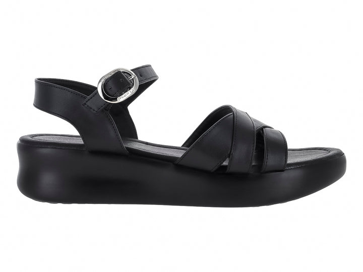 Sandalia de plataforma color negro con correas cruzadas y hebilla ajustable.