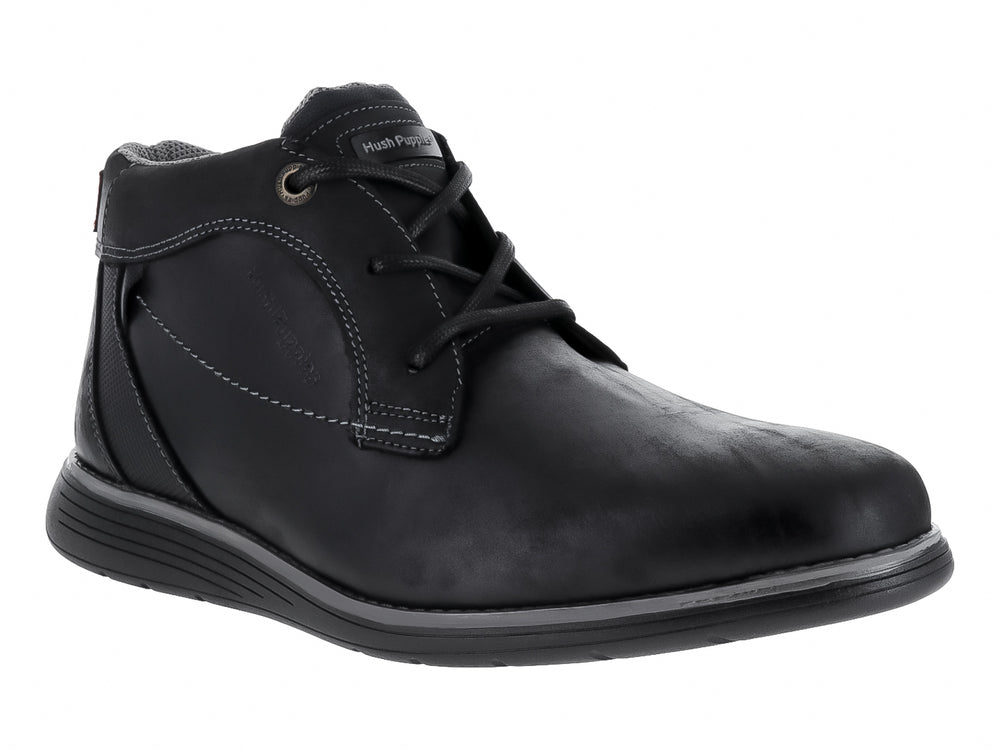 Zapato casual de cuero negro con cordones y suela gris oscuro.