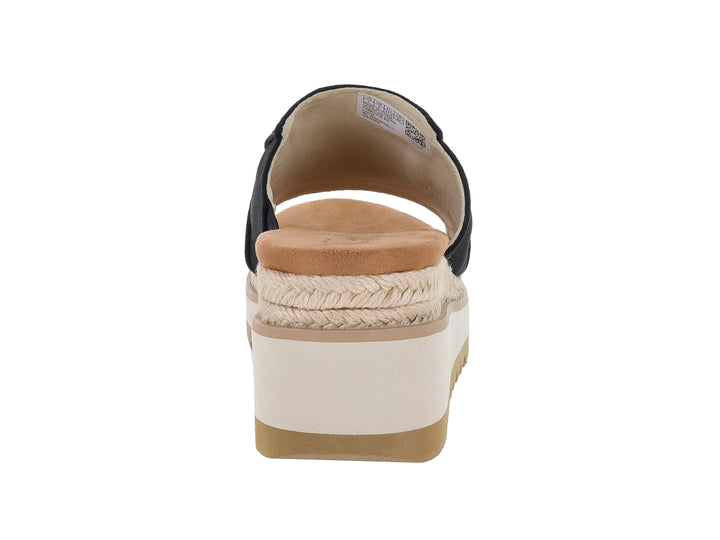Sandalia TOMS de plataforma color negro con suela blanca y beige y detalle de cuerda.