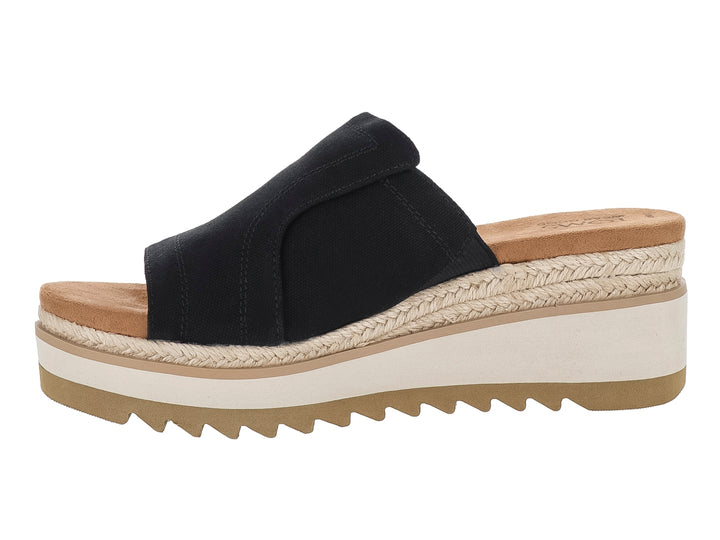Sandalia TOMS de plataforma color negro con suela blanca y beige y detalle de cuerda.