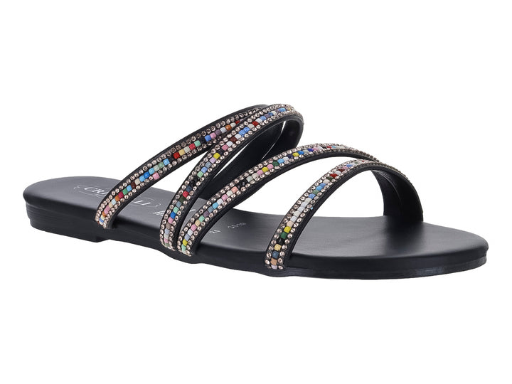 Sandalia plana negra con tiras adornadas con pedrería multicolor.