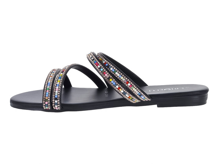Sandalia plana negra con tiras adornadas con pedrería multicolor.