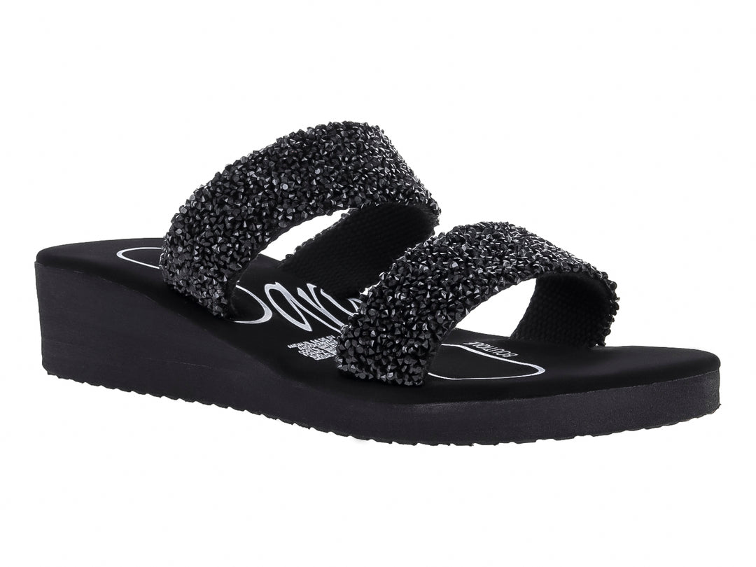 Sandalias negras de plataforma con dos correas decoradas con texturas brillantes.