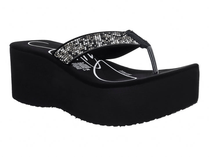 Sandalia de plataforma color negro con tira brillante decorada con lentejuelas.