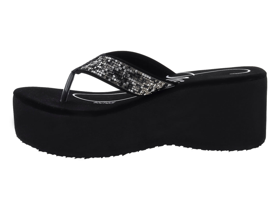 Sandalia de plataforma color negro con tira brillante decorada con lentejuelas.
