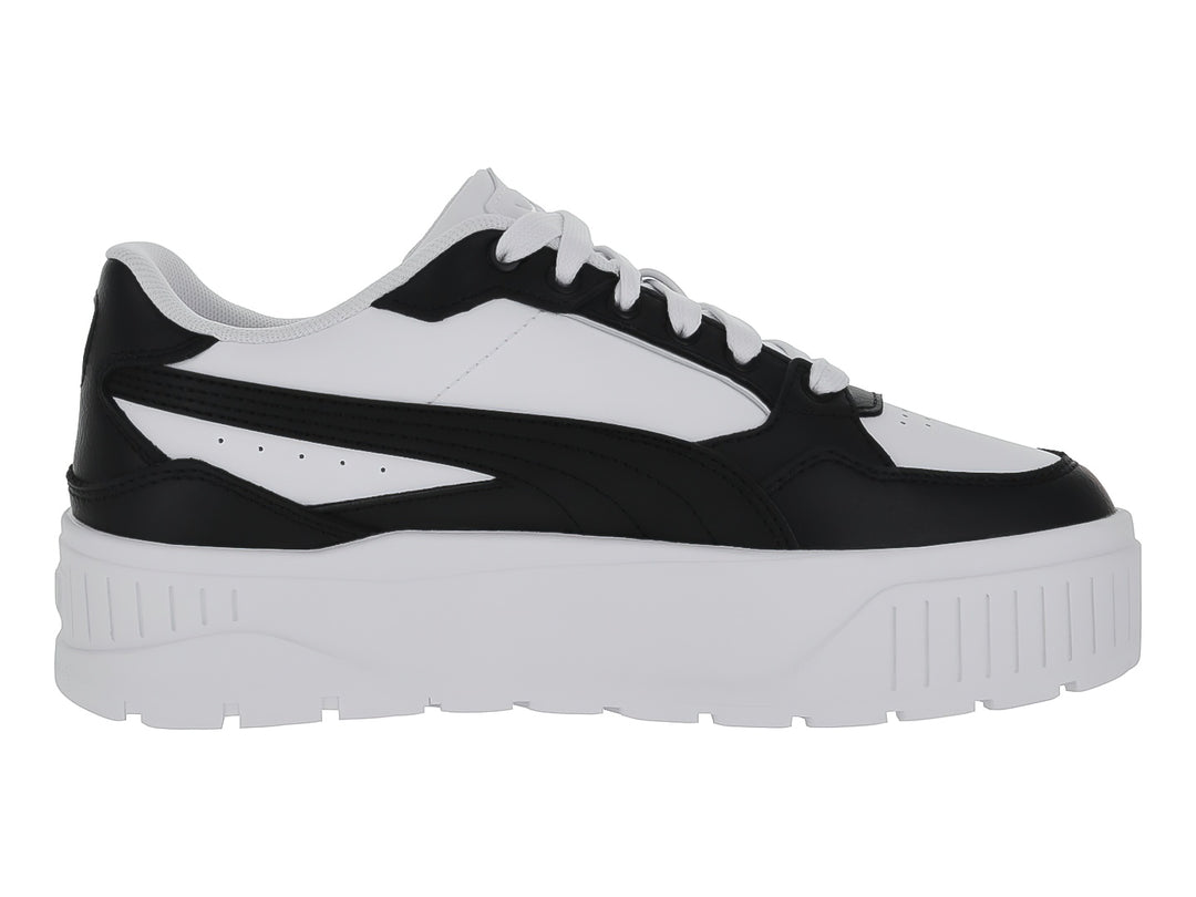 Tenis Puma Carmen II Idol en colores blanco y negro con suela de plataforma blanca.