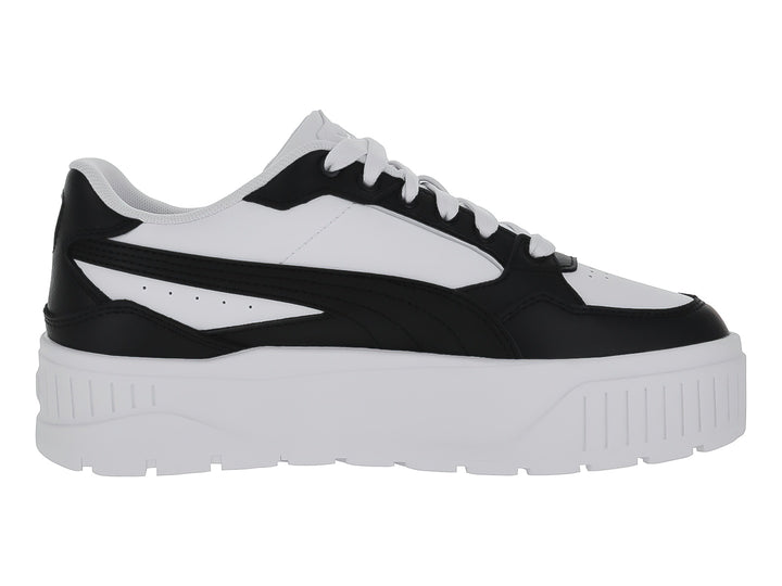 Tenis Puma Carmen II Idol en colores blanco y negro con suela de plataforma blanca.