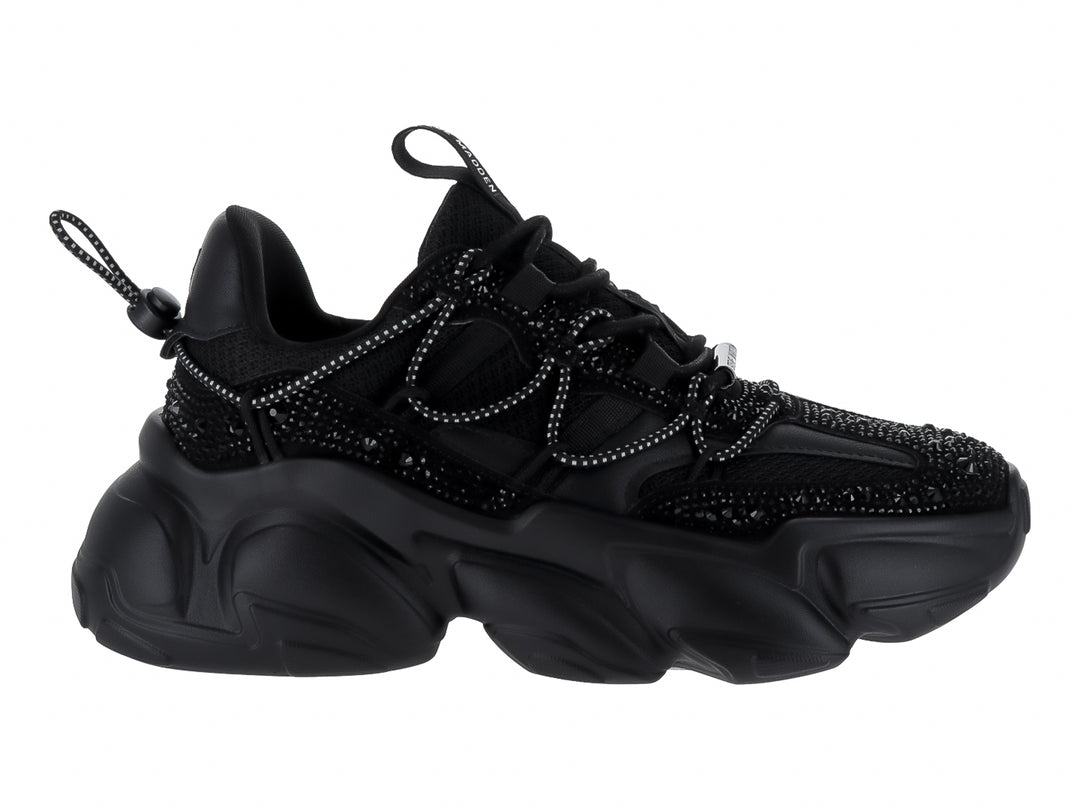 Tenis negros de terciopelo Steve Madden con suela chunky y detalles brillantes.