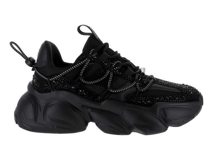 Tenis negros de terciopelo Steve Madden con suela chunky y detalles brillantes.