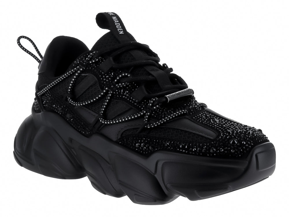 Tenis negros de terciopelo Steve Madden con suela chunky y detalles brillantes.