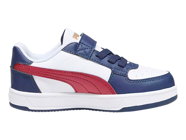 Tenis PUMA Caven 2.0 AC+PS para niño en colores blanco, azul marino y rojo con cierre de velcro.