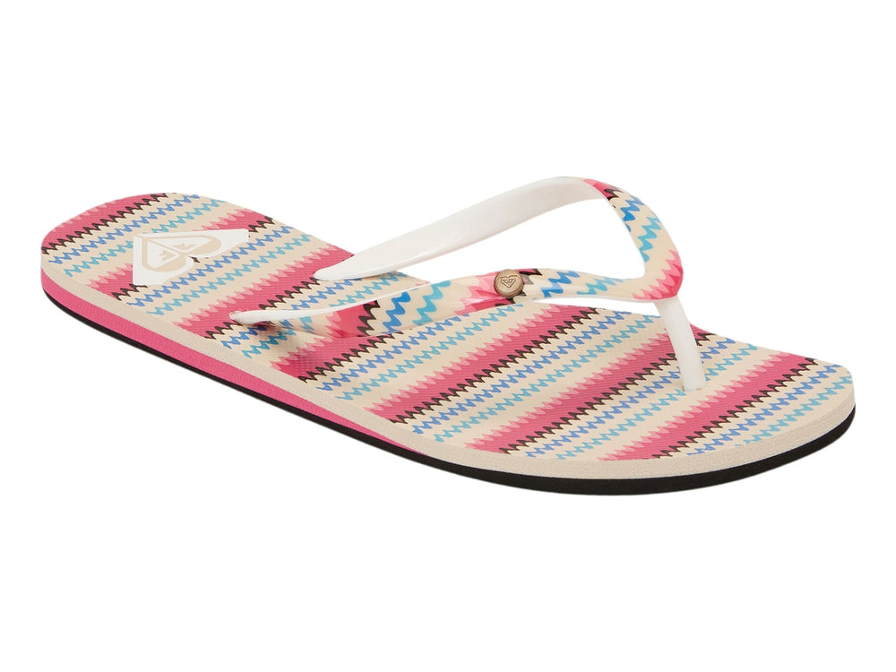 Sandalias planas Roxy con tiras en patrón de zigzag multicolor y suela negra con detalle rosa.
