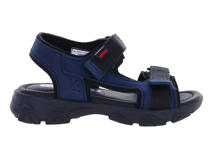 Sandalia infantil color azul marino con cierres de velcro y suela robusta.