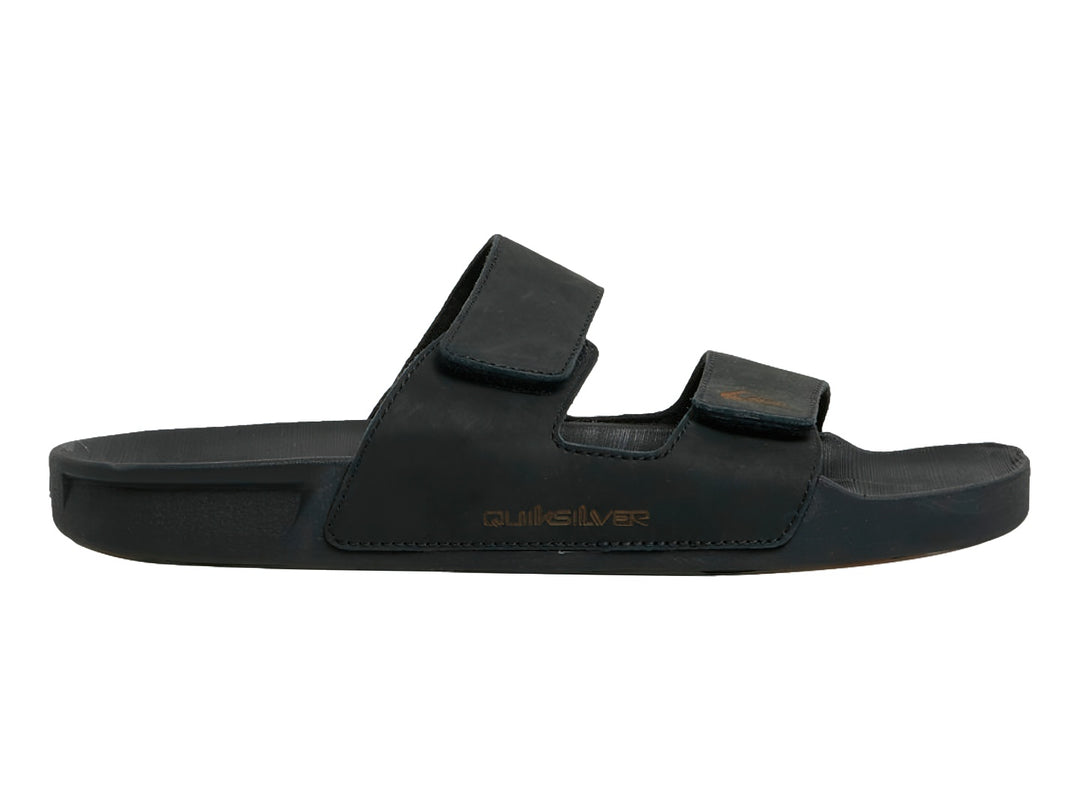 Sandalia negra de cuero Quiksilver con dos correas ajustables y suela plana.