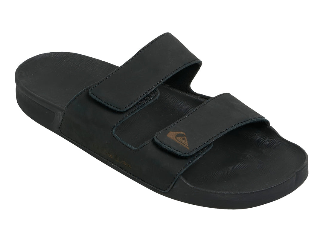 Sandalia negra de cuero Quiksilver con dos correas ajustables y suela plana.