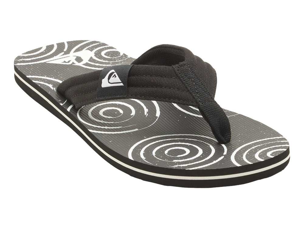 Sandalias Quiksilver negras con suela blanca y detalles gráficos en la plantilla.