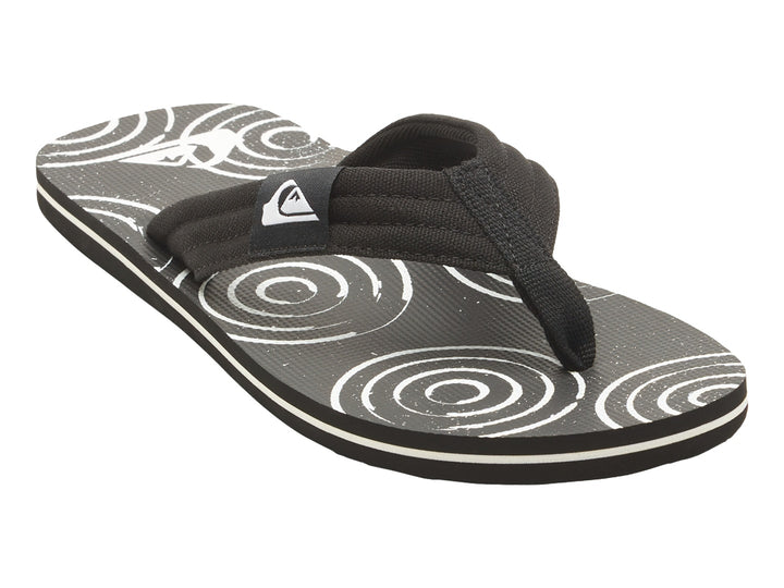 Sandalias Quiksilver negras con suela blanca y detalles gráficos en la plantilla.