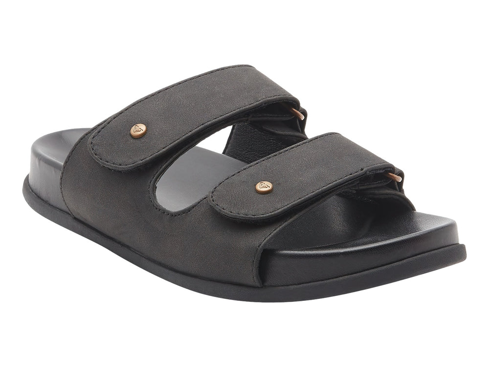 Sandalia slide negra con dos correas y botones decorativos dorados.