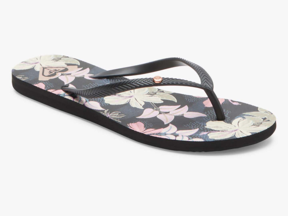 Sandalias planas ROXY color azul índigo con estampado floral y tiras negras.