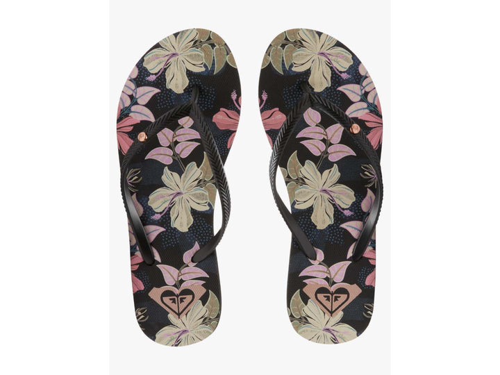Sandalias planas ROXY color azul índigo con estampado floral y tiras negras.