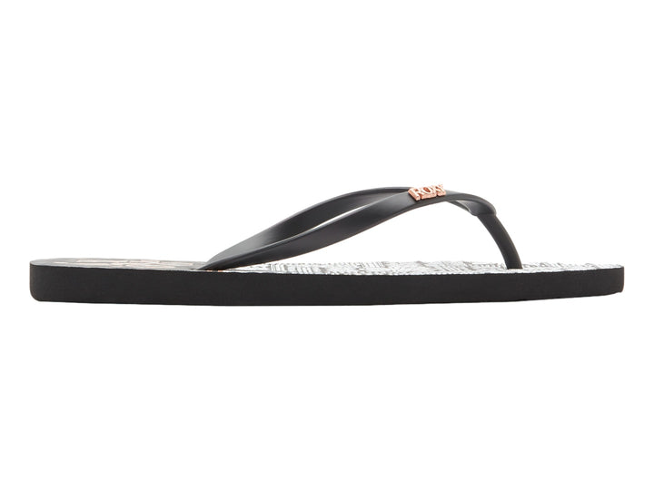 Sandalias Roxy de dedo con correas negras y plantilla blanca con estampado en negro.