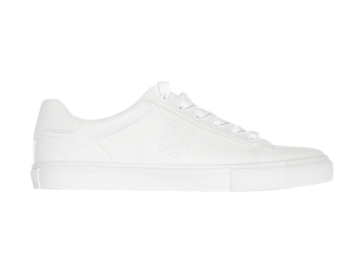 Tenis Tommy Hilfiger modelo Twle Ighton en color blanco total con suela plana y agujetas.