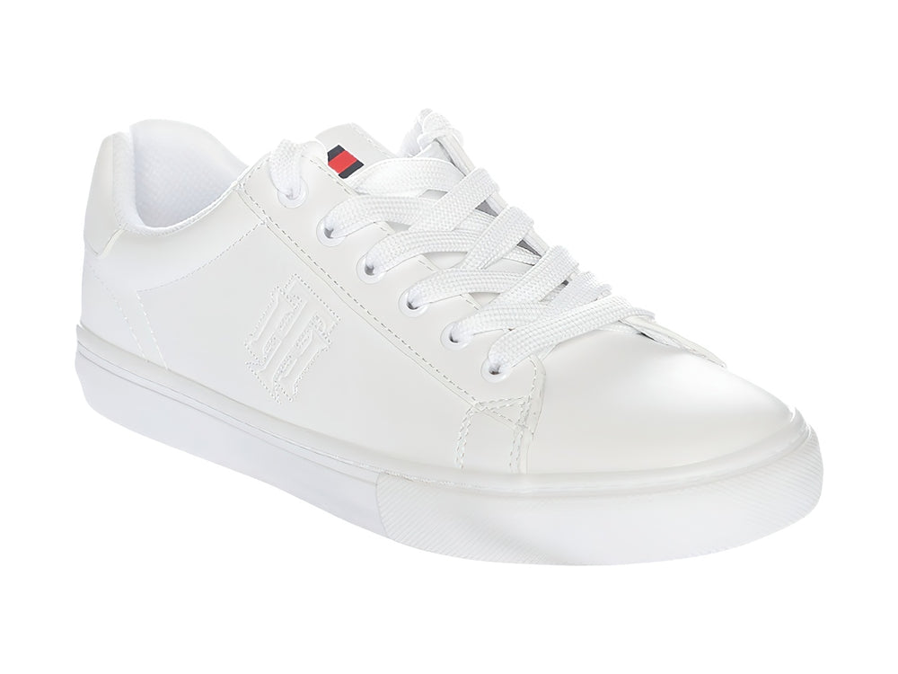 Tenis Tommy Hilfiger modelo Twle Ighton en color blanco total con suela plana y agujetas.
