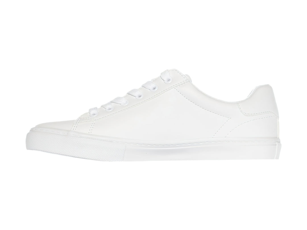 Tenis Tommy Hilfiger modelo Twle Ighton en color blanco total con suela plana y agujetas.