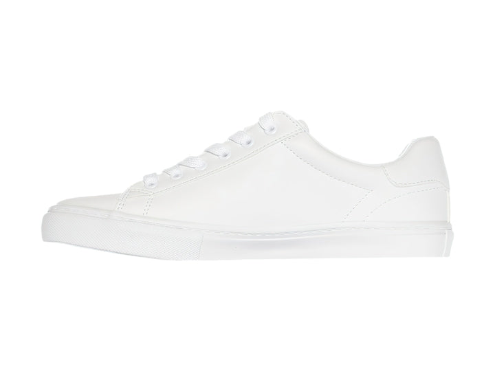 Tenis Tommy Hilfiger modelo Twle Ighton en color blanco total con suela plana y agujetas.