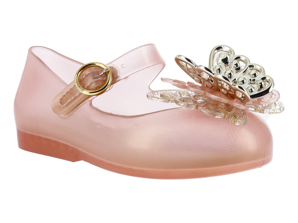 Zapato Mini Melissa color oro con correa y adorno de mariposa brillante en la punta para Niña.