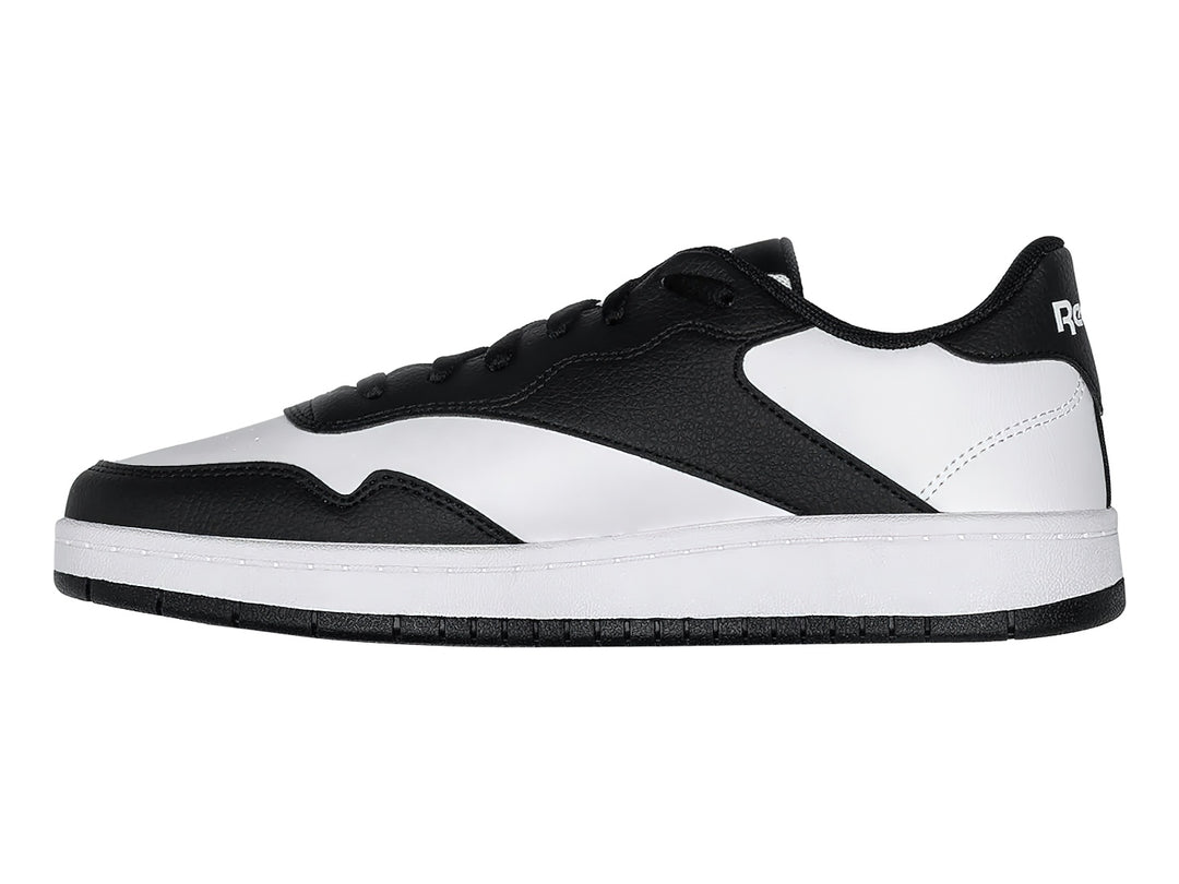 Tenis de baloncesto Reebok en colores blanco y negro con suela blanca y detalles laterales negros.