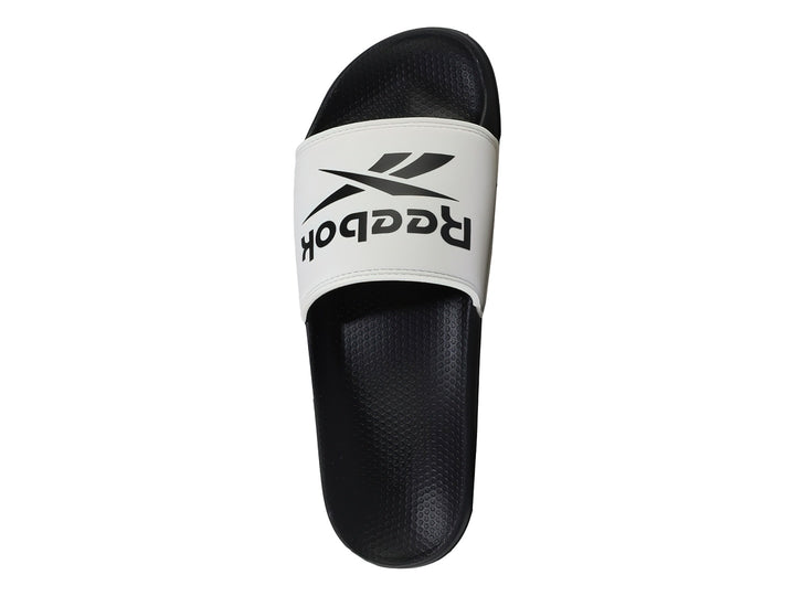 Sandalia deslizable Reebok con correa blanca y suela negra.