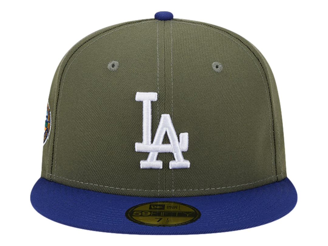 Gorra New Era de color verde oliva con visera azul y logo blanco de los Dodgers en el frente.