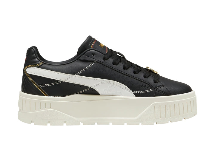 Tenis PUMA Carmen II Class Act en color negro con suela de plataforma blanca y detalles en dorado.