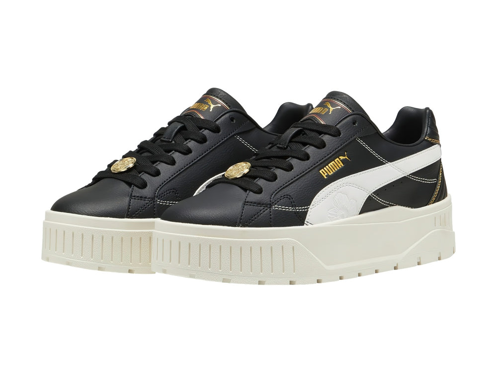 Tenis PUMA Carmen II Class Act en color negro con suela de plataforma blanca y detalles en dorado.